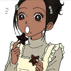 a cartoon girl eating a star shaped cookie