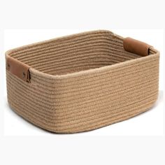 an empty basket with leather handles on a white background