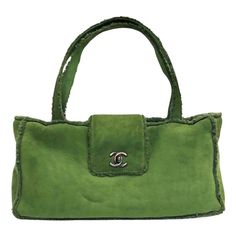 - Chanel green suede shoulder shoulder handbag from 1998 collection. - Featuring green shearling mouton trim overall. - CC turnlock flap closure. - Interior zip pocket. - Length: 32cm. Height: 16cm. Width: 7.5cm. Handle Drop: 18cm (measurements are approximately). - Comes with authentic card. Chanel Green, Chanel Top, Green Purse, Pretty Bags, Green Suede, Shoulder Handbag, Cute Bags, Baby Bag, Vintage Bags