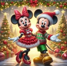 two mickey and minnie mouses dressed up in christmas attire, standing next to each other