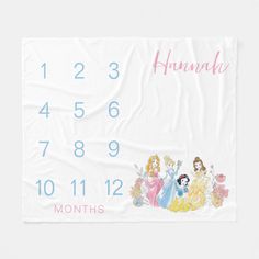 a white towel with princesses on it and the numbers for each month in pink