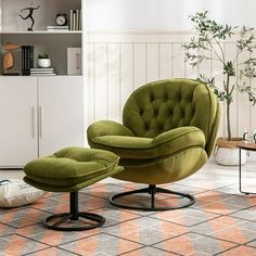 a green chair and ottoman in a living room