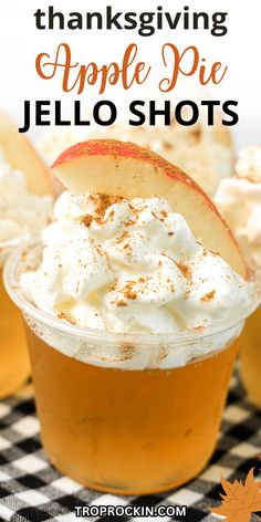 an apple pie jello shot in a glass with whipped cream on top