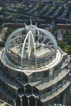 an aerial view of the top of a building with many windows and metal structures on it