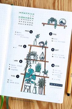 an open notebook with plants on it next to a pencil and plant potted plants