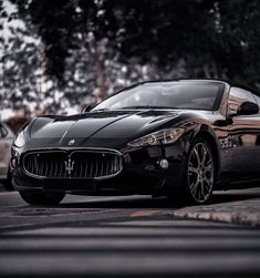 a masera is parked on the side of the road