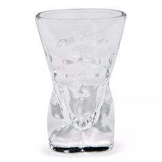 a clear glass vase sitting on top of a white table