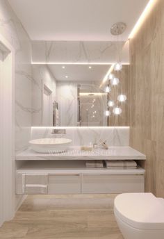 a modern bathroom with marble walls and flooring