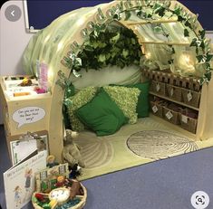 a bed made to look like a toy store with lots of stuff on the floor