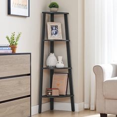 a living room with a white chair and a tall shelf in the corner next to a window