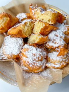 powdered sugar covered pastries in a bowl