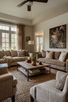 a living room filled with furniture and a ceiling fan