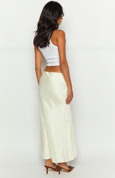 * Cream Maxi Skirt 
 * 
 
 * HOW TO STYLE: 
 * This cream maxi skirt is the ultimate wardrobe basic ()! Featuring a flattering bias cut, the must-have maxi can be dressed up for down for any occasion! For a festival () look, we love wearing ours with cowboy boots, lace shrug, and sunnies ().  
 * 
 
 * FEATURES: 
 * Cut on the bias 
 * High waist 
 * Invisible zip with hook and eye closure 
 * Maxi length 
 * Lined 
 * Mid weight satin 
 * Non stretch Cream Feminine Relaxed Maxi Skirt, Chic Fitted Cream Maxi Skirt, Luxury Chic Cream Maxi Skirt, Luxury Lined Cream Maxi Skirt, Luxury Cream Relaxed Maxi Skirt, Lace Shrug, 60's Dress, Prom Midi Dress, Summer Playsuit