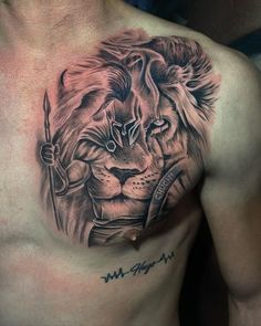 a man with a lion tattoo on his chest