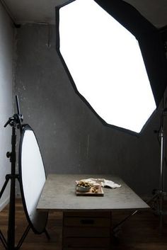 a table with food on it in front of a light