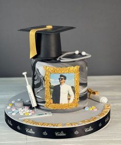 a graduation cake with an image of a man on it