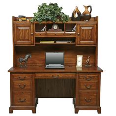 a wooden desk with a computer on top of it