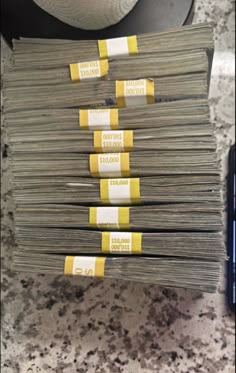 stacks of money sitting on top of a counter