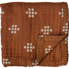 an orange and white blanket with squares on it