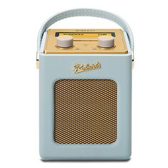 an old fashioned radio is sitting on a white surface with a blue handle and two yellow knobs