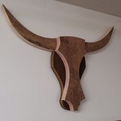 a cow's head is mounted on the wall