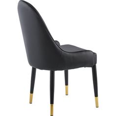 a black leather chair with gold legs