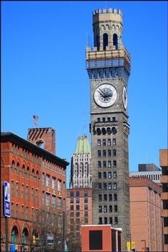 a tall clock tower towering over a city