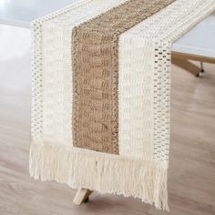 a table runner with fringes on it