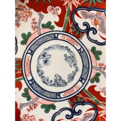 an ornate plate with blue and red designs on it