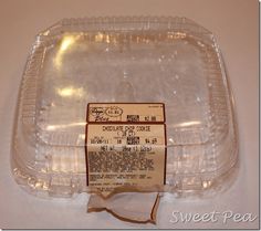 an empty plastic container sitting on top of a table