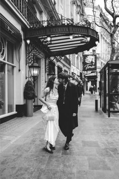 Bride and groom kissing while walking in the streets of London by Royal Opera. House London, Photography Editorial, Wedding Reception Venues