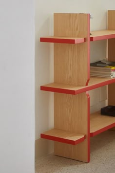 a book shelf with books and magazines on it