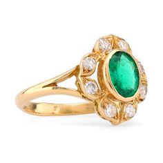 an emerald and diamond ring, by van cleef in yellow gold with diamonds