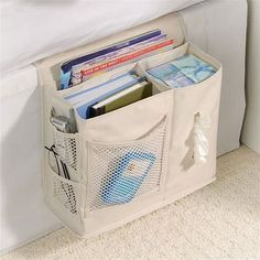 a white storage bag filled with books and magazines