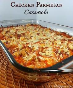 chicken parmesan casserole in a glass dish on a wicker table