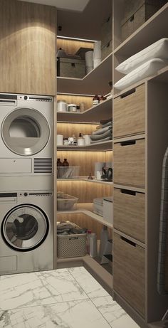 a washer and dryer in a room with wooden shelves on the wall, next to a marble counter top