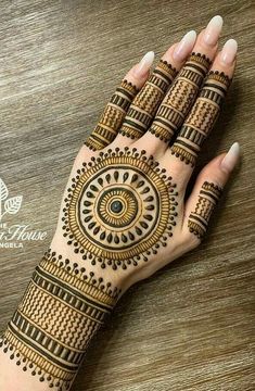 henna tattoo on the palm of a woman's hand