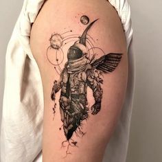 an astronaut tattoo on the right thigh