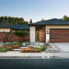 a house with landscaping in front of it