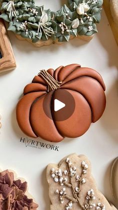 an assortment of cookies and decorations on a table with the words happy thanksgiving written in front of them