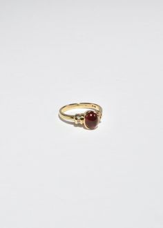 Beautiful vintage gold ring with a polished ruby cabochon and diamond detail. Stamped 10k. Material: 10k gold, ruby, diamond. We recommend storing in a dry place and periodic polishing with a cloth. Ruby Ring Designs Unique, Ring Designs Unique, Ruby Ring Designs, Gold Thumb Rings, Vintage Gold Ring, Ruby Ring Vintage, Ruby Diamond Ring, Vintage Gold Rings, Ruby Diamond Rings