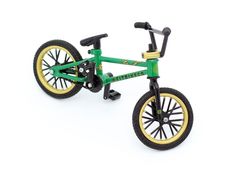 a green and yellow toy bike on a white background