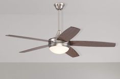 a ceiling fan that is mounted on the wall and has two light bulbs attached to it