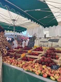 an open air market with lots of fruit on display