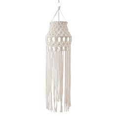 a white macrame hanging from the ceiling