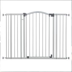 a white gate with two black handles on the top and bottom bars in front of it