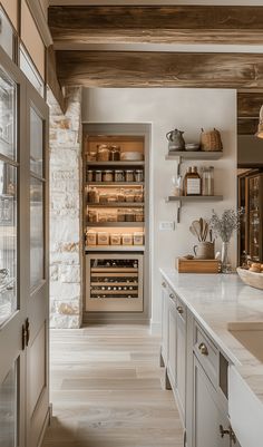 the kitchen is clean and ready to be used as a wine tasting area for guests