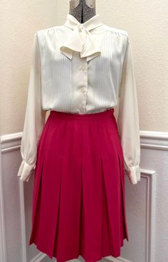 Vintage 1960s Century of Boston Pink Wool Pleated Skirt! Description:   - Vintage Pink Wool Pleated Skirt   - Button and Metal Zipper Side Closure Condition:   - Fantastic Vintage Condition!   - No visible flaws, tears, or stains Measurements (Laid Flat):  Waist: 13" Hips: 18" Center Back to Hem: 22 1/2" **Please note that all sales are final, regardless of size, fit, color, etc. Be sure to check measurements and read the entire description before purchasing! If you have any questions about an i Vintage Full Skirt Bottoms With Buttons, Vintage Formal Full Skirt Bottoms, Retro Formal Lined Skirt, Vintage Full Skirt For Workwear, Vintage Pleated Skirt For Work, Retro Pleated Lined Skirt For Work, Vintage Formal Skirt, Vintage Pleated Skirt For Spring Workwear, Wool Pleated Skirt