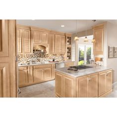 a kitchen with wooden cabinets and marble counter tops