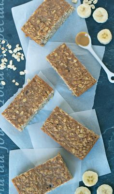 granola bars with banana slices and peanut butter on top, next to oatmeal